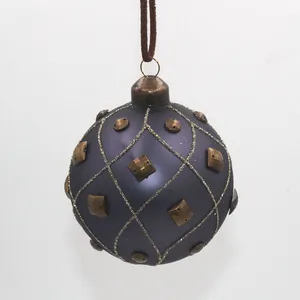 This elegant, 80mm round dark purple matte glass bauble Christmas ornament features a sparkling gold glitter finish, and decorative accents that adds a touch of sophistication to any holiday decor. It's perfect for adding a touch of luxury to your Christmas tree or for creating festive centerpieces.