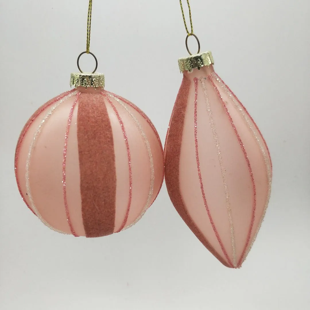 These pink striped Christmas ornaments are perfect for adding a touch of festive cheer to your home or Christmas tree.