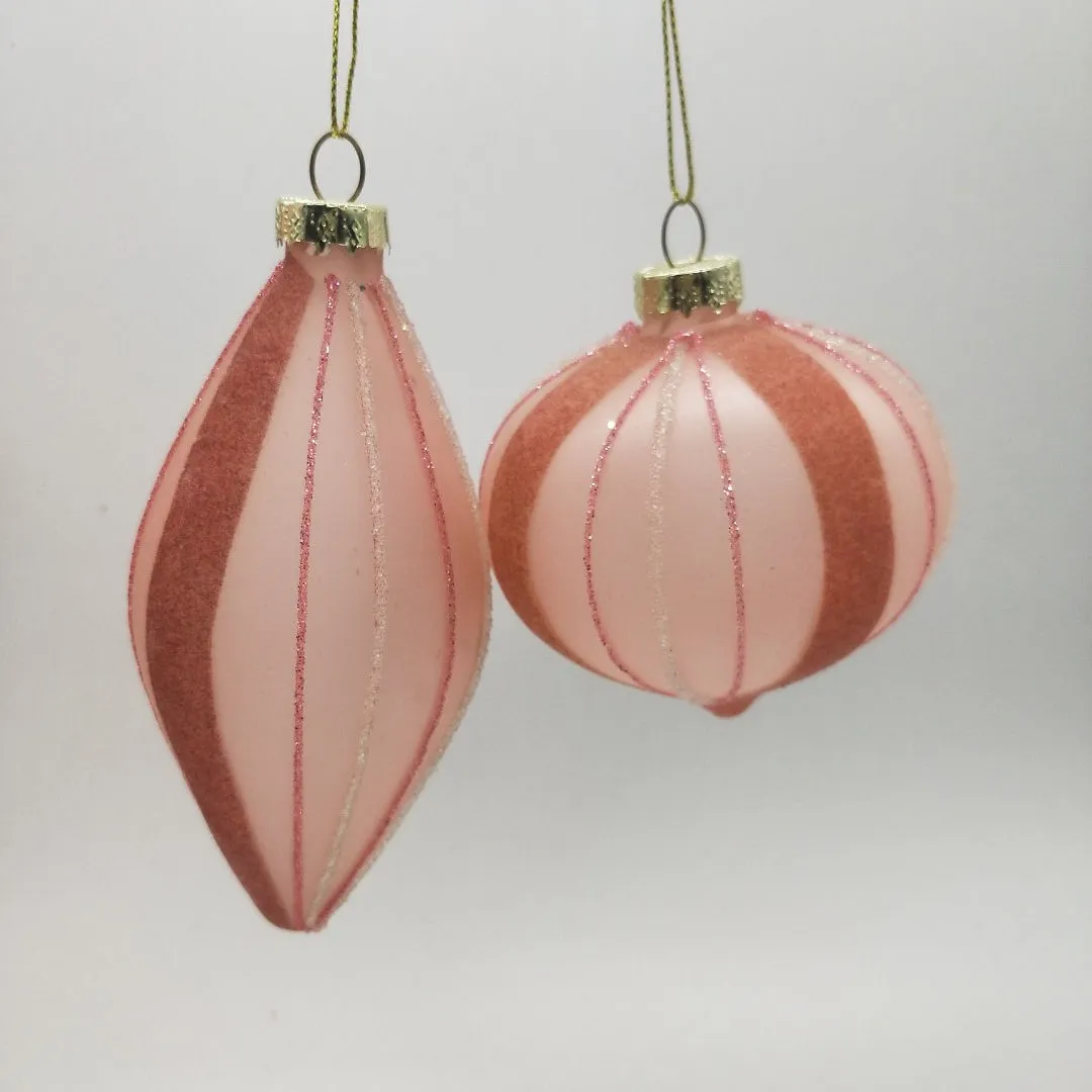 These Christmas ornaments are made of high-quality glass and feature a delicate pink striped design.