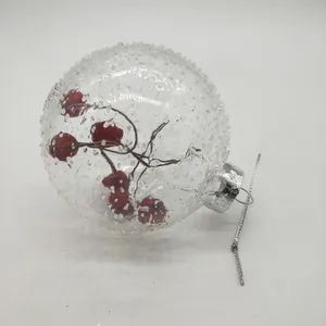 This product features a delicate and elegant pattern with clear glass and red berries that are added after the blowing process.
