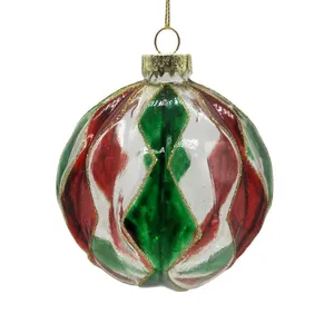 This product is a 8cm clear glass Christmas ball ornament with red and green Christmas tree decorations. It is a fillable bauble that can be used for holiday party decorations.