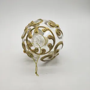 This Christmas ornament ball is crafted from high-quality glass, ensuring durability and a beautiful, elegant finish. The golden pattern adds a touch of sophistication and sparkle.