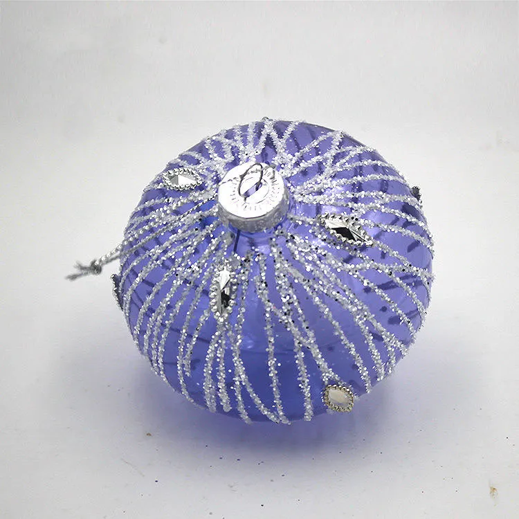 This product is a glass ball Christmas ornament that features a beautiful purple hue and a unique onion shape. It is made of high-quality glass and is perfect for adding a touch of elegance to your Christmas tree or home decor.