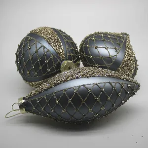 This product is made of glass, with a grey matte finish and gold glitter accents.