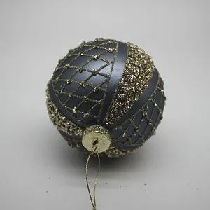This product features a diamond pattern hand-painted with gold glitter, adding a touch of sparkle and sophistication to the ornament.