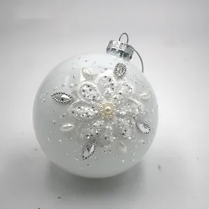 This product is crafted from delicate glass and features a shimmering pearl white finish that adds a touch of elegance to any holiday decor.