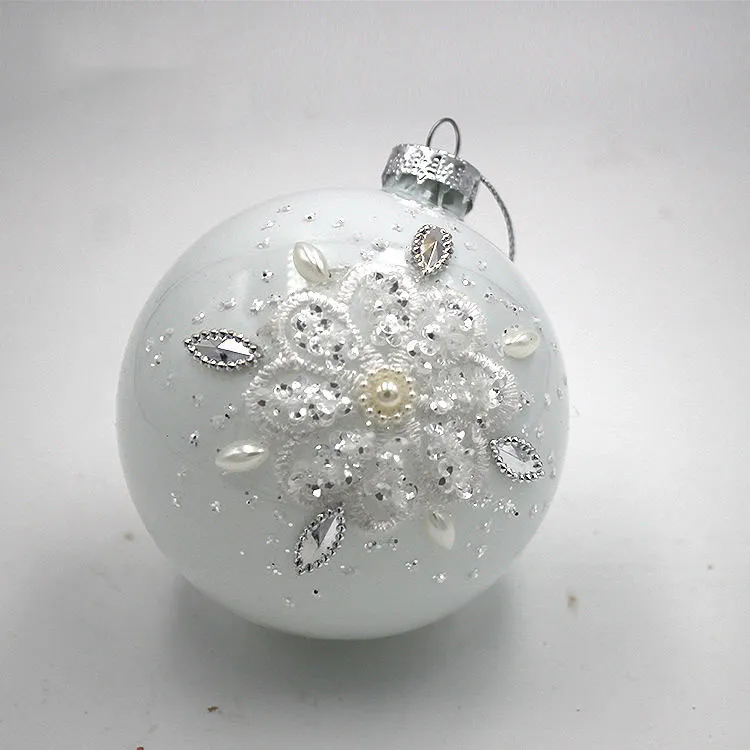 This product is crafted from delicate glass and features a shimmering pearl white finish that adds a touch of elegance to any holiday decor.