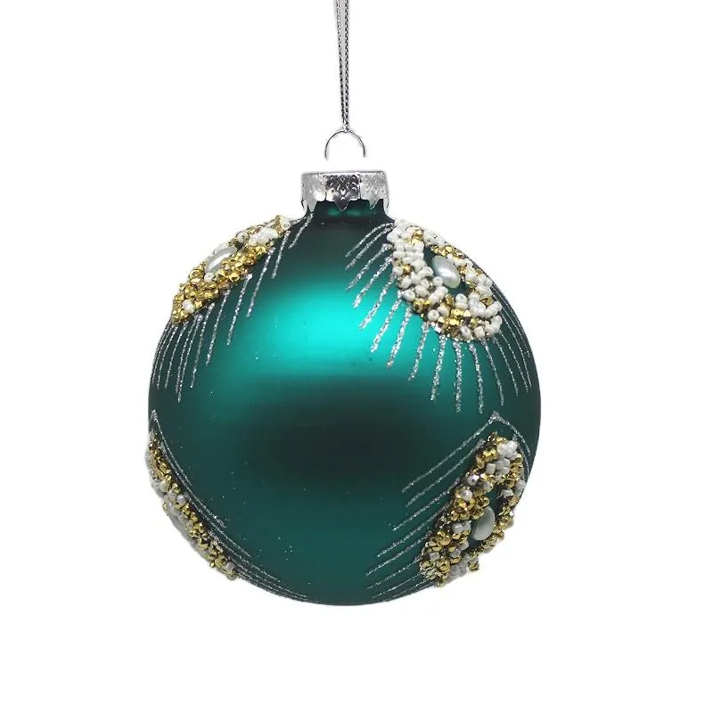 This teal blue round glass Christmas ornament features a hand-painted design with gold and white decorations. It's perfect for adding a touch of elegance to your holiday decor.
