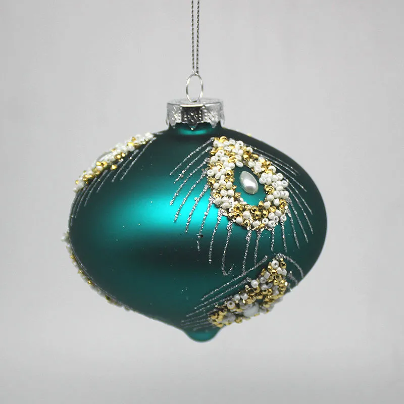 This teal blue Christmas ornament is perfect for adding a festive touch to your Christmas tree, table, or mantel.
