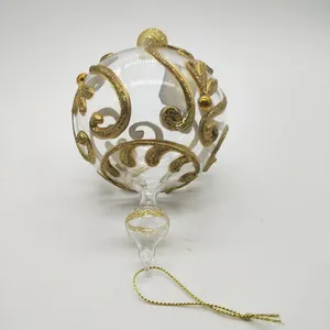 This ornament ball features a timeless and elegant design that complements a variety of Christmas tree styles, from traditional to modern. Its delicate golden pattern adds a touch of sophistication and charm.