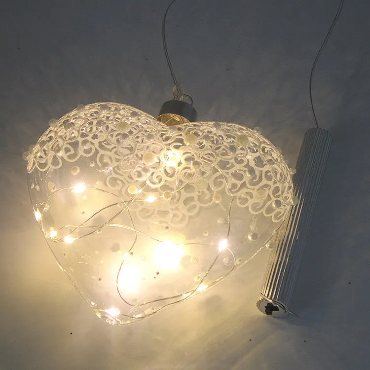 This product is meticulously crafted from glass and features a heart shape with intricate lace details. It is a beautiful and durable decorative piece.
