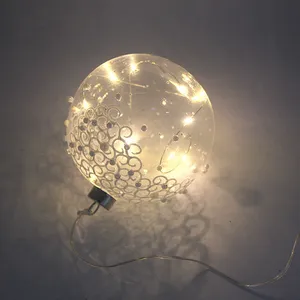 This product has a lace and bead design that is applied to the clear glass ball. It is 12cm in diameter and battery powered.
