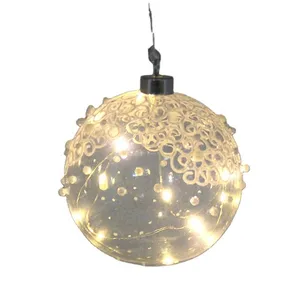 This product is made of clear glass with LED lights, lace and beads. It is 12cm in diameter and battery powered.