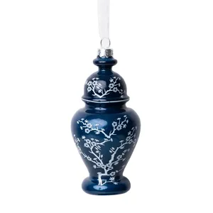 This elegant blue glass vase ornament, adorned with delicate white floral designs, adds a touch of sophistication to your Christmas tree.