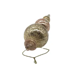 This finial ornament is made from blown glass, a traditional method of glassmaking that creates unique and intricate designs.