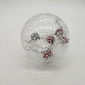 This product is made from high-quality clear glass with a textured surface and red berries inside. It is a durable and elegant ornament for your holiday décor.