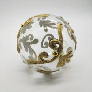 This product is decorated with a gold glitter pattern that is applied by hand.