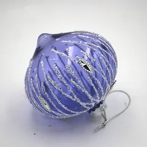 This product is a traditional Christmas ornament with a modern twist. It features a classic onion shape and a beautiful purple hue, but it is also accented with silver glitter for a touch of sparkle. The result is a product that is both elegant and festive.