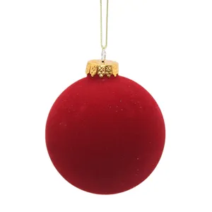 This festive red Christmas ball ornament is a beautiful and elegant addition to your holiday decor. Its velvety soft texture and rich color will add a touch of luxury to your Christmas tree or any other holiday display.