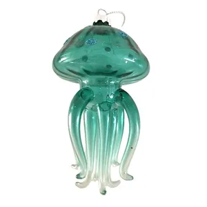 This glass blown jellyfish ornament is a whimsical ocean-themed Christmas tree decoration. With its blue jellyfish shape, this custom-made Christmas ornament adds a unique touch to your holiday decor.