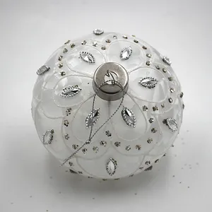 Elegant white glass Christmas ball ornament with silver and gold embellishments, perfect for wholesale holiday and wedding decorations.