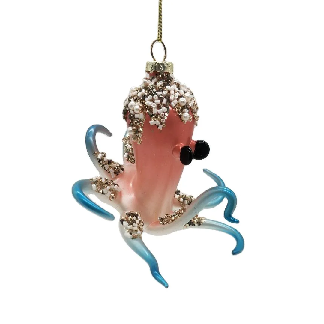This glass octopus Christmas ornament is a unique and whimsical addition to any holiday decor. With its handmade ocean theme, it's perfect for adding a touch of nautical charm to your tree or mantel. This ornament is available for wholesale and custom orders, and measures 12x12x10cm.