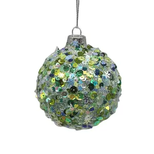 This product is a Christmas tree ornament with a green sequined glass ball, perfect for decorating your home during the holiday season.