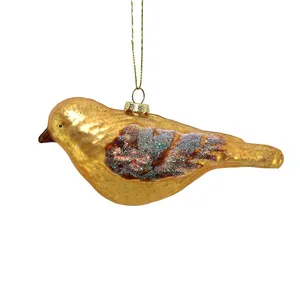 This glass bird ornament is a charming and whimsical addition to your holiday decor, featuring delicate details and a vibrant color palette.
