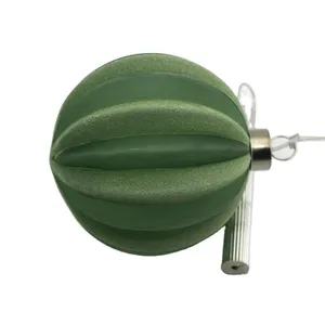 This product is a Christmas ornament, with a frosted green finish and a ribbed texture. It features a silver hanging loop and is perfect for adding a touch of elegance to your holiday décor.