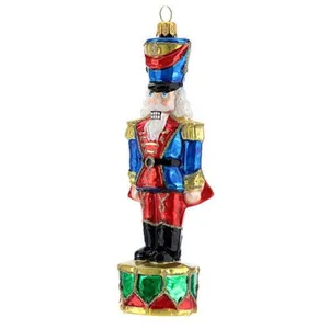 This hand-blown glass ornament is a beautiful and unique piece of holiday decor. It features a nutcracker design, with intricate details and vibrant colors. It's a perfect way to add a touch of holiday cheer to your home.