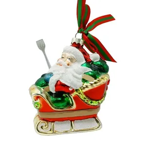 This product features a detailed Santa Claus with a sparkling finish, achieved through a unique hand-painted design. The glass ornament is adorned with glittery accents that give it a festive sparkle.