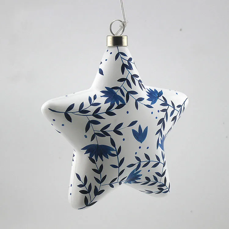 This product is hand-painted with a delicate blue floral pattern, which is created using intricate brushstrokes and a careful eye for detail. The pattern is vibrant and beautiful, adding a touch of elegance and artistry to the ornament. The meticulous detail and vibrant colors of this product are a testament to the skill of the artist.