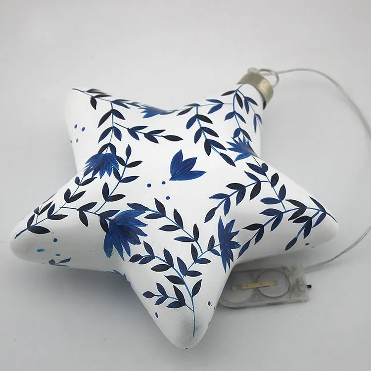 This product has a classic and elegant style, perfect for adding a touch of sophistication to your Christmas decor. The delicate floral pattern and the star-shaped design create a beautiful and timeless look. It is a beautiful and elegant addition to any Christmas decor, especially for those who prefer a more traditional look.