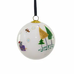 This whimsical glass ornament is perfect for adding a touch of winter magic to your Christmas tree. The delicate hand-painted scene features a sleigh, birds, and trees, all set against a snowy backdrop.