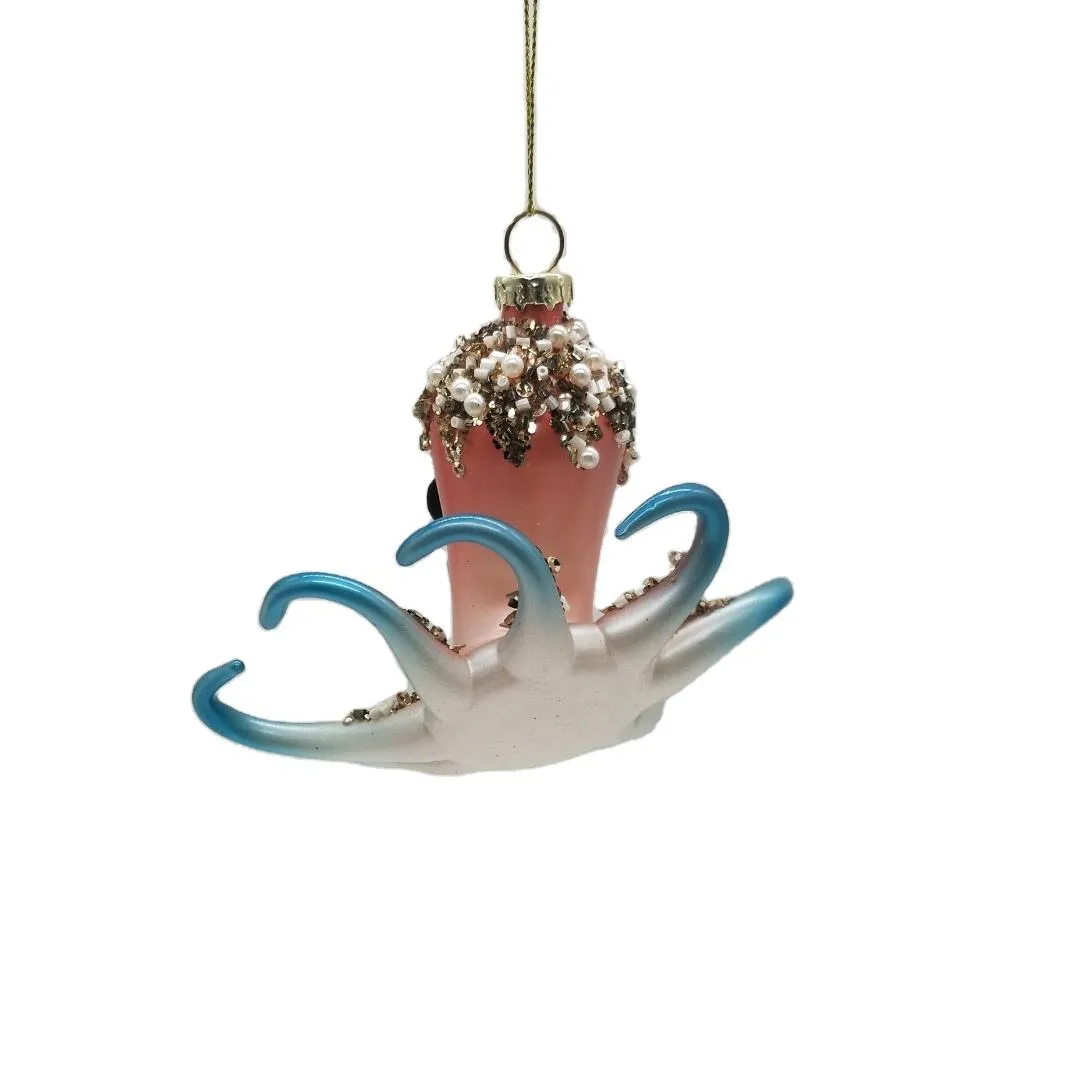 This octopus ornament is perfect for adding a festive touch to your Christmas tree, mantel, or any other holiday display. It can also be used as a unique gift for friends and family. Its eye-catching design is sure to make it a standout decoration.