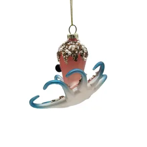 This Christmas ornament is handcrafted with meticulous attention to detail. The glass is blown into shape and then meticulously decorated with intricate details. This intricate process results in a unique and high-quality ornament that is sure to be treasured for years to come.