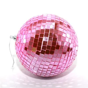 This product is a pink mirrored Christmas ornament ball, perfect for adding a touch of sparkle to your holiday decor. It's also great for parties and events.