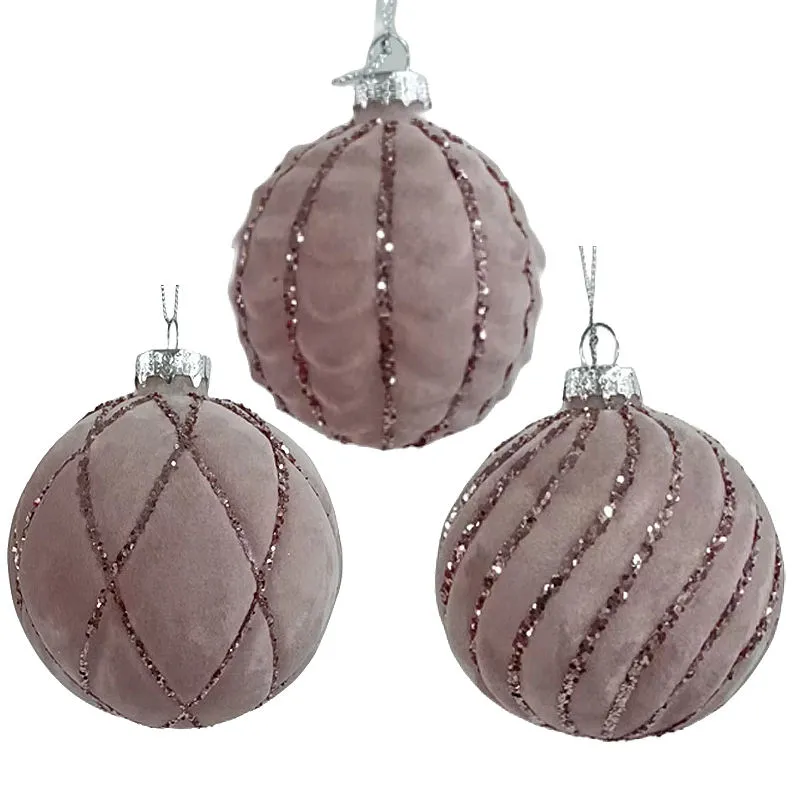 A set of 3 pink velvet Christmas ornaments with glitter accents is a perfect addition to your holiday decorations.