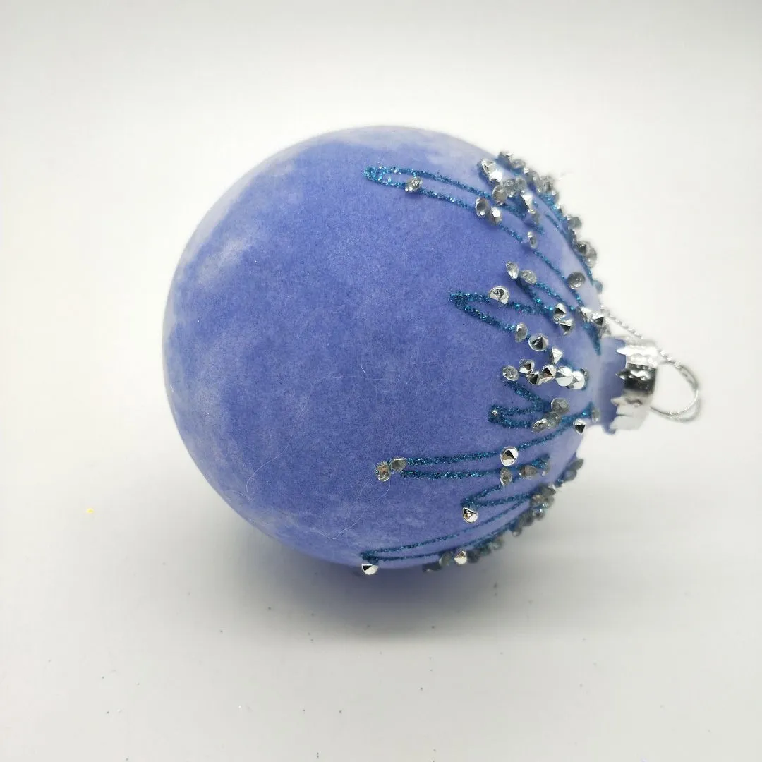 This product is made from high-quality glass that is blown into a round shape. The velvet flocking is then applied to the surface, giving it a soft and luxurious feel.