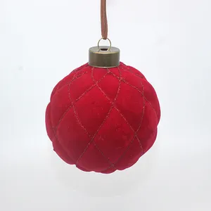 This 8cm red velvet Christmas ornament is made of glass and features a quilted design. It's perfect for adding a touch of elegance to your Christmas tree.  Wholesale bulk orders are available.