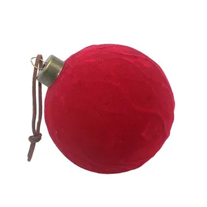 These red velvet surface Christmas glass balls ornaments are perfect for adding a touch of elegance and festive cheer to your holiday decor. The baubles are designed to hang from your Christmas tree, and they come in a variety of styles.