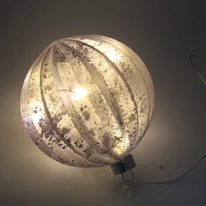 This Christmas ornament has a classic and elegant design, featuring a matte finish, delicate, ribbed texture, and a built-in LED light. It's a beautiful addition to any holiday décor.