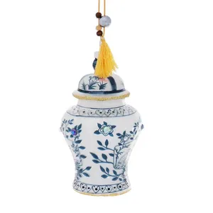 This blue and white porcelain ginger jar Christmas ornament is perfect for adding a touch of traditional Chinese style to your holiday décor. The ornament features a yellow tassel and intricate floral designs, making it a beautiful and unique addition to any tree.