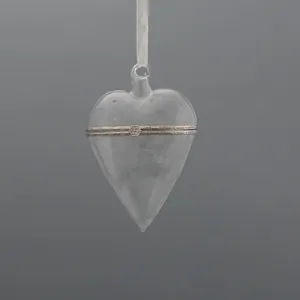 This clear glass heart ornament is perfect for wholesale orders and custom design. Adding sparkle to your holiday decor.