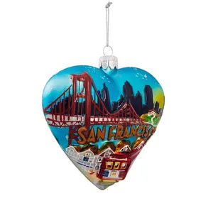 This heart-shaped glass ornament features the iconic Golden Gate Bridge and San Francisco skyline, making it a perfect addition to your Christmas tree or home decor.
