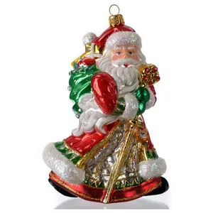 This hand-blown glass Christmas ornament features Santa Claus carrying a bag of gifts, perfect for wholesale orders.  The ornament is sure to add a touch of festive cheer to any Christmas tree.