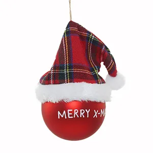A festive red glass ball ornament adorned with a plaid Santa hat, perfect for adding a touch of holiday cheer to your Christmas tree or decor. The ornament features a "Merry Xmas" inscription and is available for custom logos and colors for bulk orders.