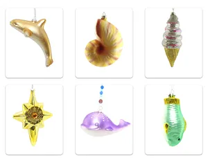 This product is a set of handmade glass Christmas ornaments featuring various sea life designs, including a seahorse, a seashell, a starfish, and a whale.