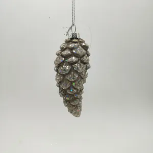 This product is made of glass and features a glitter finish that adds a sparkly and festive touch. The pinecone shape is hand-blown and beautifully crafted.