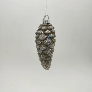 This product is a glass Christmas ornament shaped like a pinecone. It is covered in glitter for a sparkly effect. The pinecone ornament is perfect for adding a touch of Christmas cheer to your home.